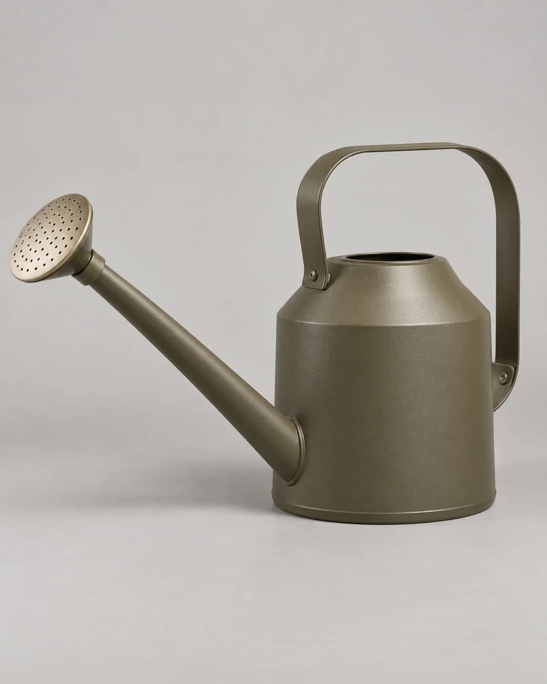 Sculptural olive watering can in a plain seller product photo