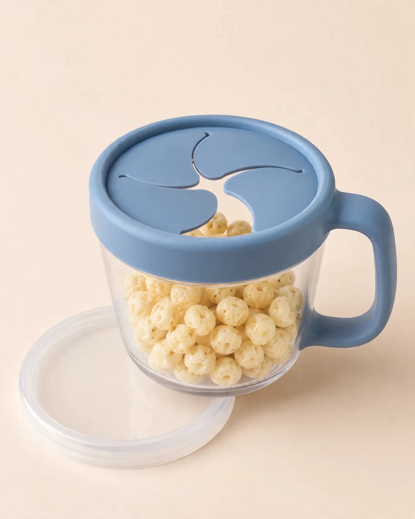 Same toddler snack cup in a feature spotlight ad showing its flexible opening