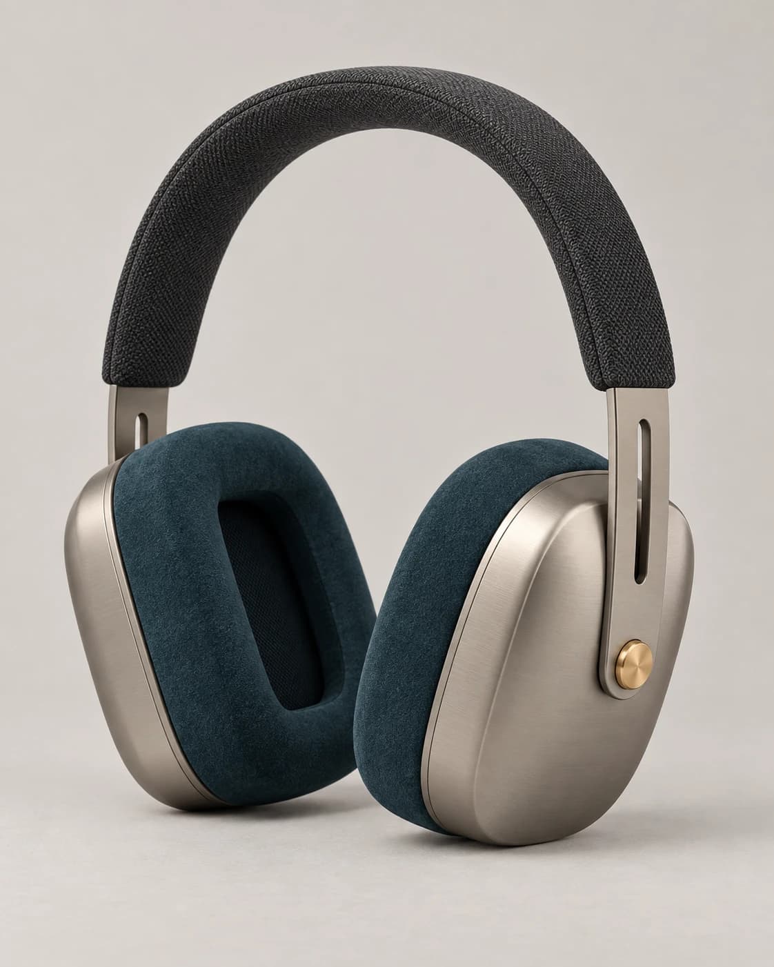 Warm-titanium over-ear headphones with deep-petrol cushions on a clean product background